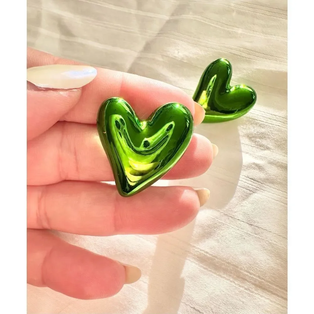 Chrome green heart stud earrings